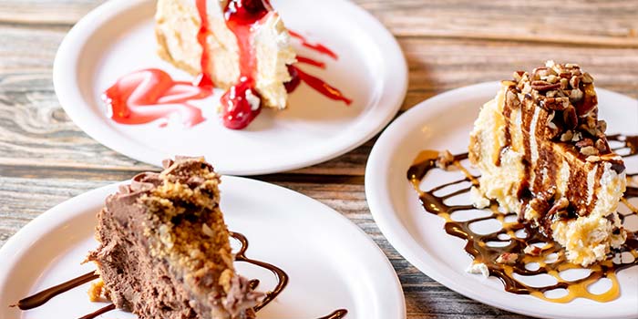 A sweet and delectable variety of cakes with pecans, cherries and more can be found at Rapids Riverside Bar & Grill in South Range WI.