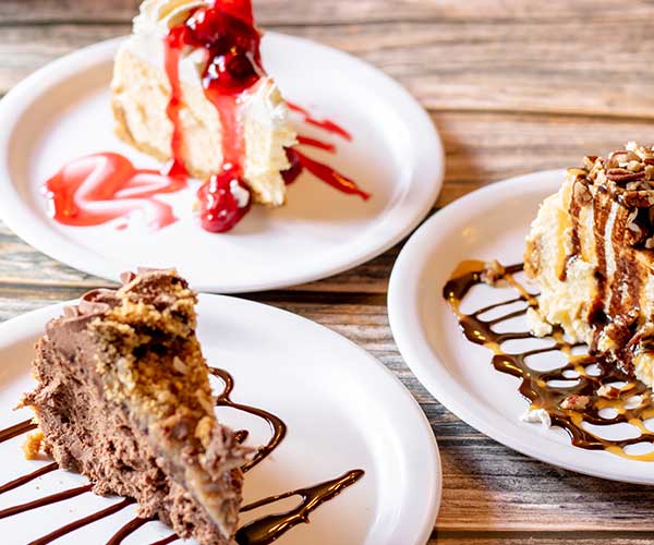 A sweet and delectable variety of cakes with pecans, cherries and more can be found at Rapids Riverside Bar & Grill in South Range WI.