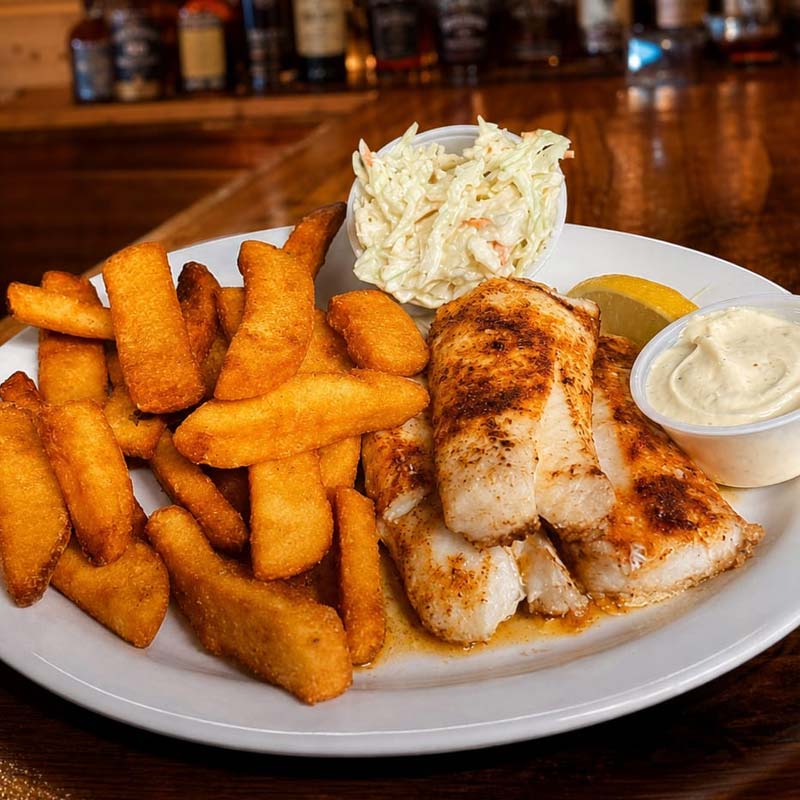 Rapids Riverside Friday Fish Fry: Fried fish, thick fries, coleslaw, tartar sauce, lemon wedge.